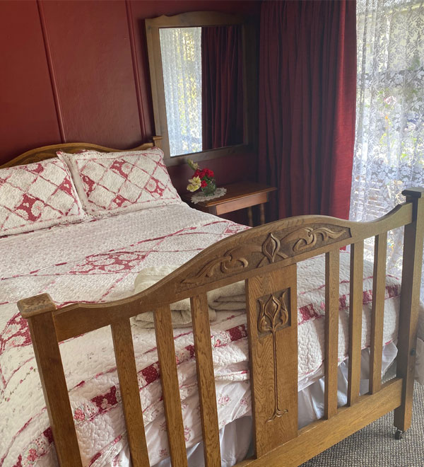 The Clematis Room queen bed at Komako Peonied bed and breakfast